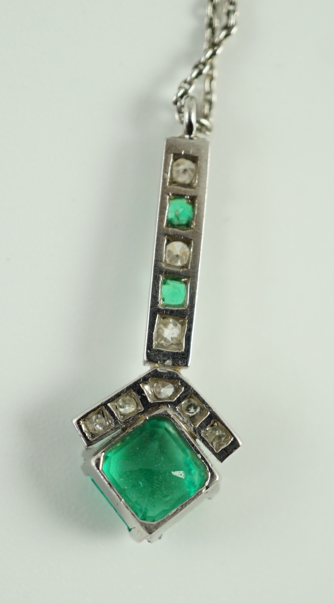 A 1920's platinum?, emerald and diamond set pendant necklace